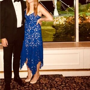 MIDI length blue and tan eyelet wedding guest dress from LuLu’s.